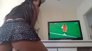 HOT CHICK WATCHES THE GAME AND SITS