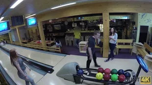 Young white girl gives blowjob in public bowling alley in POV